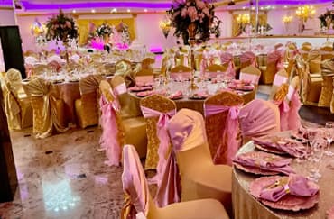 blue and gold themed banquet hall with tables set up